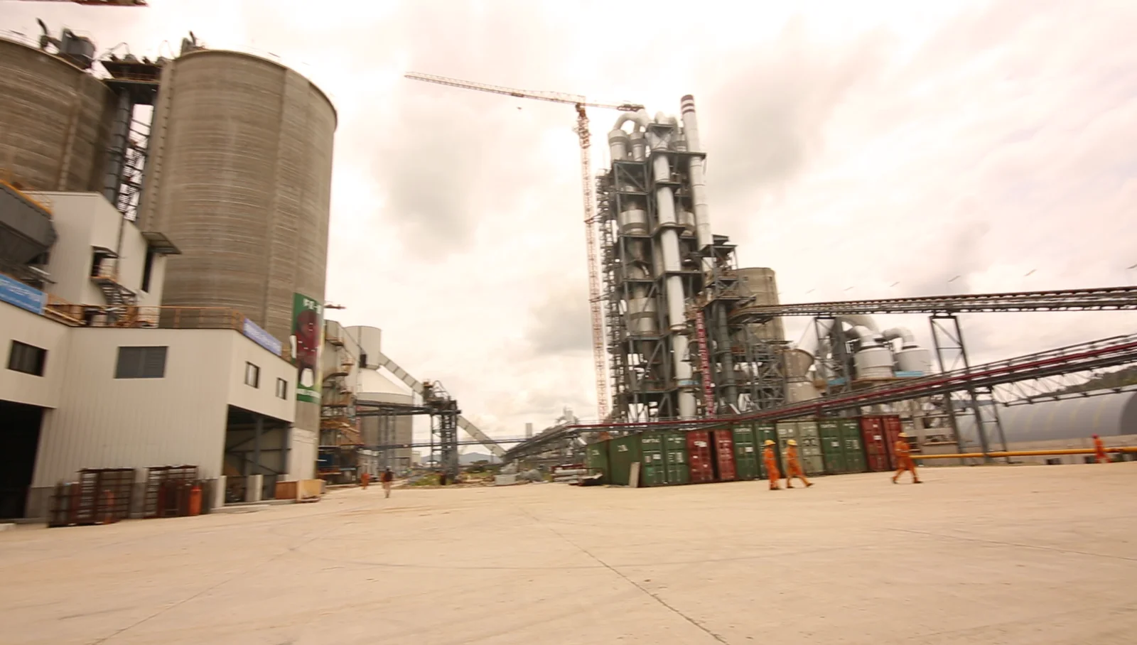 Janica crew on site at an industrial plant with storage tanks